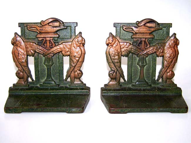 A nice pair of Art Deco Antique Bookends circa 1910-1920 depicting two owls flanking the Lamp of Learning.